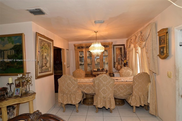 tiled dining area with an inviting chandelier