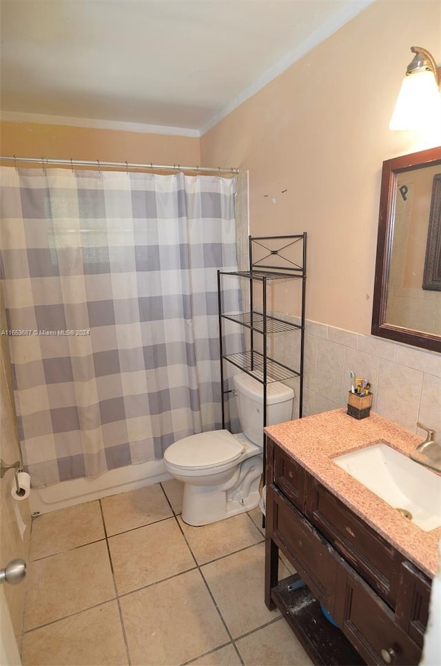 bathroom featuring tasteful backsplash, crown molding, tile walls, tile patterned flooring, and toilet