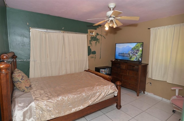 bedroom with ceiling fan and light tile patterned flooring