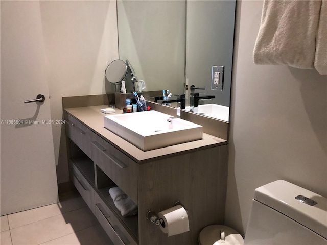 bathroom featuring vanity, toilet, and tile patterned floors