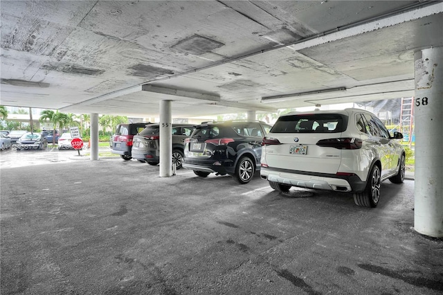 garage featuring a carport