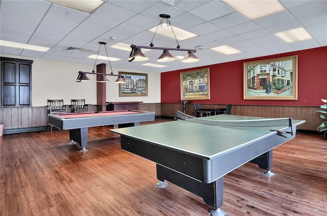 recreation room with pool table, hardwood / wood-style floors, and a paneled ceiling