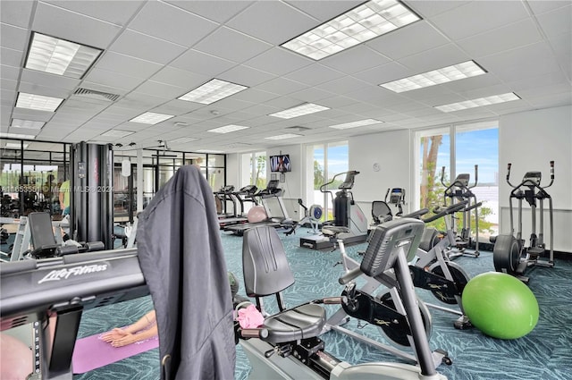 gym featuring a drop ceiling