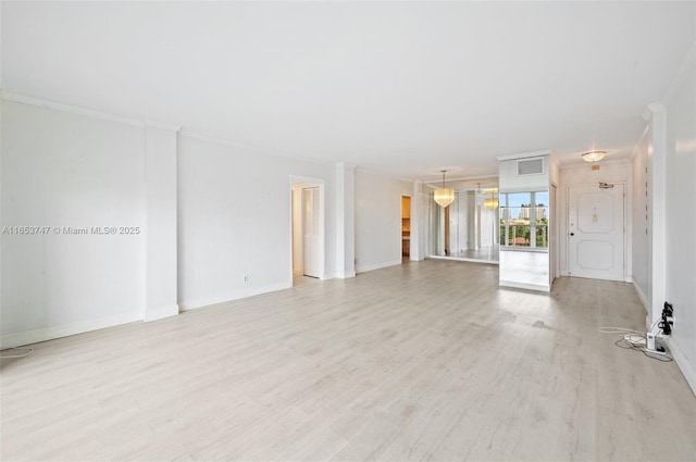 unfurnished living room with light wood-type flooring and crown molding