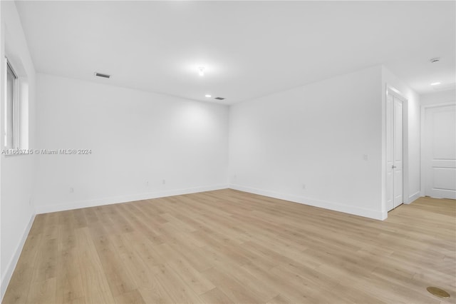 unfurnished room featuring light hardwood / wood-style floors