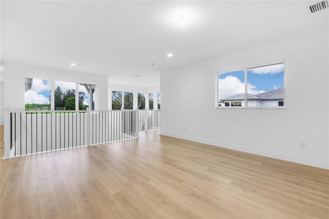 unfurnished room featuring light hardwood / wood-style flooring