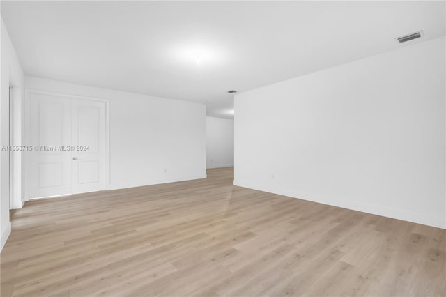 unfurnished room with light hardwood / wood-style floors