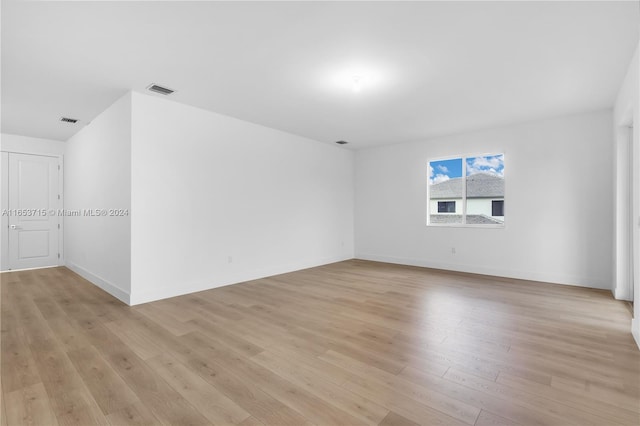 unfurnished room with light hardwood / wood-style flooring