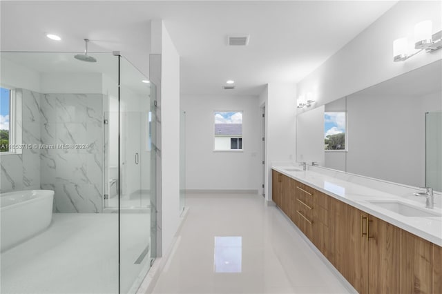 bathroom with separate shower and tub and vanity