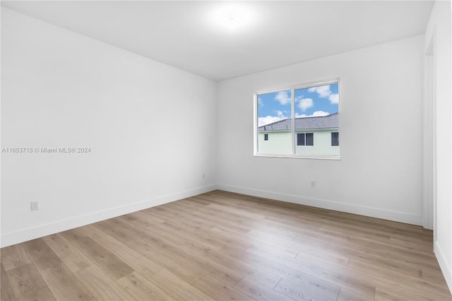 unfurnished room featuring light hardwood / wood-style flooring