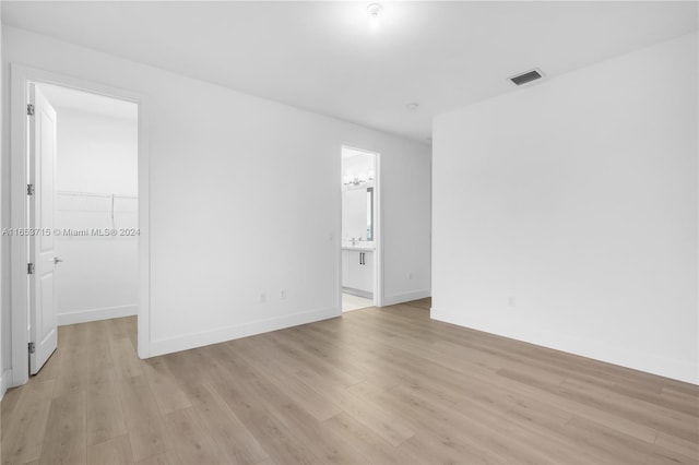 empty room with light wood-type flooring