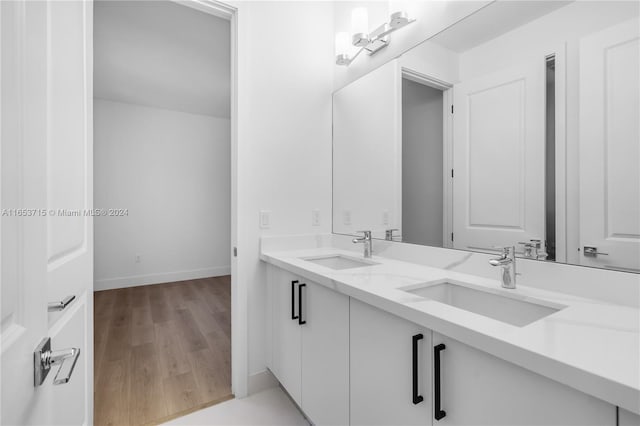 bathroom with vanity and hardwood / wood-style floors