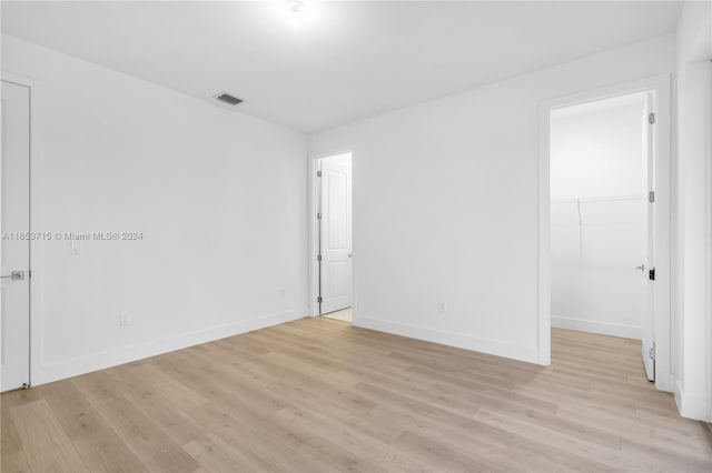 spare room with light hardwood / wood-style flooring