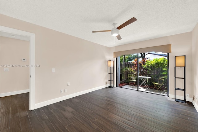 unfurnished room featuring ceiling fan, a textured ceiling, and dark hardwood / wood-style flooring