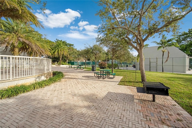 view of home's community with a lawn