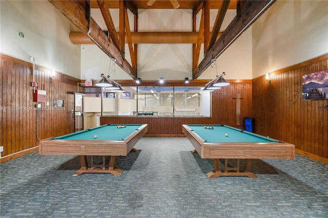 recreation room featuring beam ceiling, a towering ceiling, and billiards