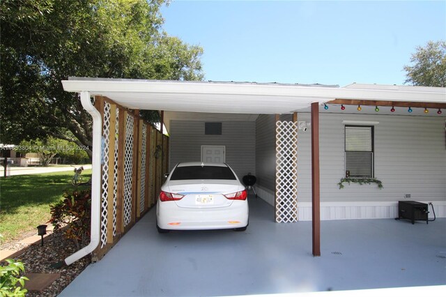 1113 Lissie Ln, Bulkhead Ridge, FL 34974 - view of parking featuring an attached carport