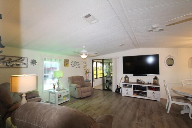 1113 Lissie Ln, Bulkhead Ridge, FL 34974 - living area featuring visible vents, wood finished floors, lofted ceiling with beams, and a healthy amount of sunlight
