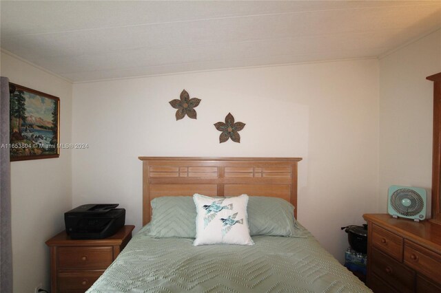 1113 Lissie Ln, Bulkhead Ridge, FL 34974 - bedroom with crown molding
