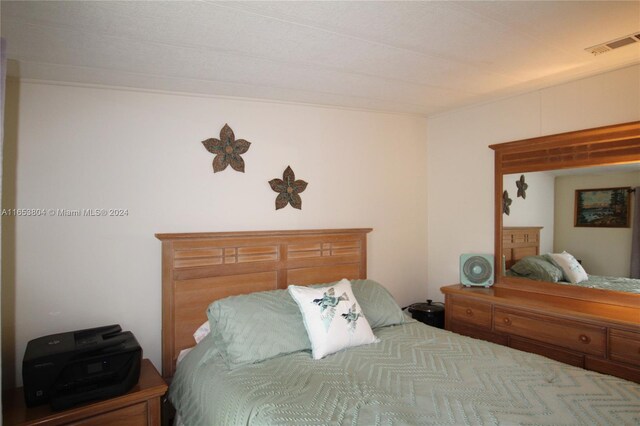 1113 Lissie Ln, Bulkhead Ridge, FL 34974 - bedroom featuring visible vents