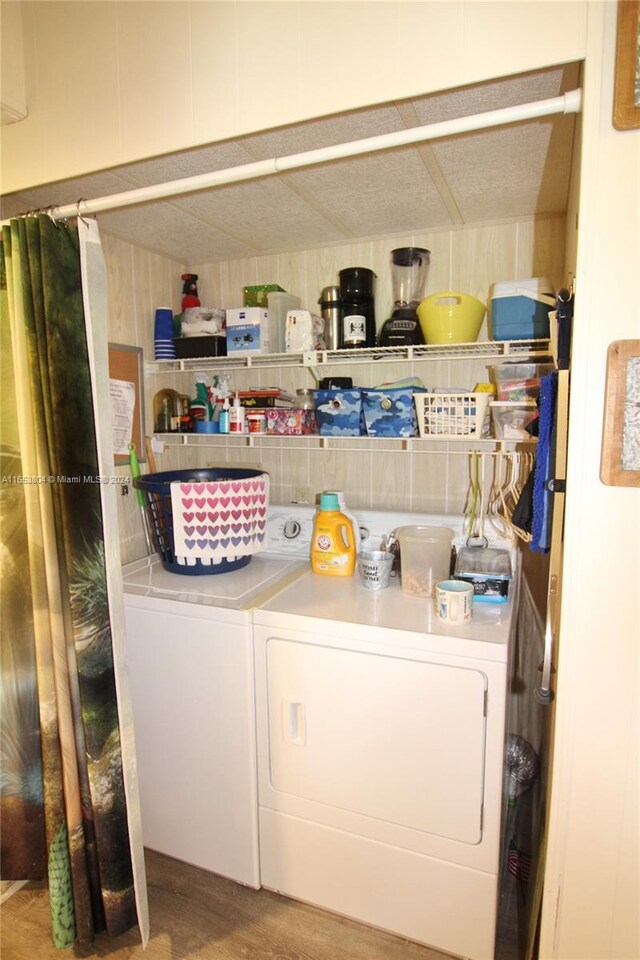 1113 Lissie Ln, Bulkhead Ridge, FL 34974 - washroom with laundry area and washer and clothes dryer