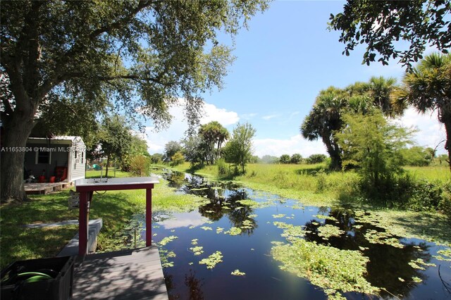 1113 Lissie Ln, Bulkhead Ridge, FL 34974 - dock area with a water view