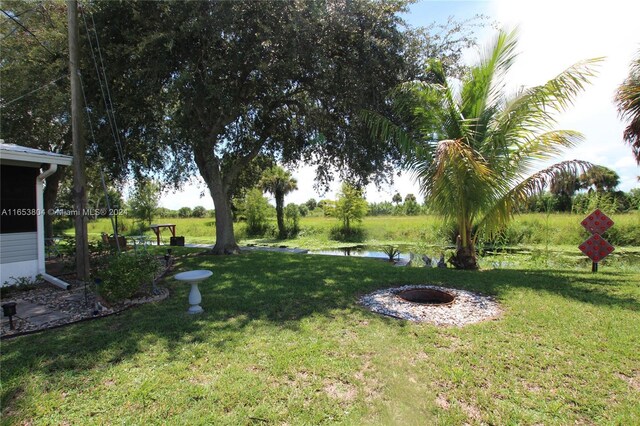 1113 Lissie Ln, Bulkhead Ridge, FL 34974 - view of yard featuring a water view
