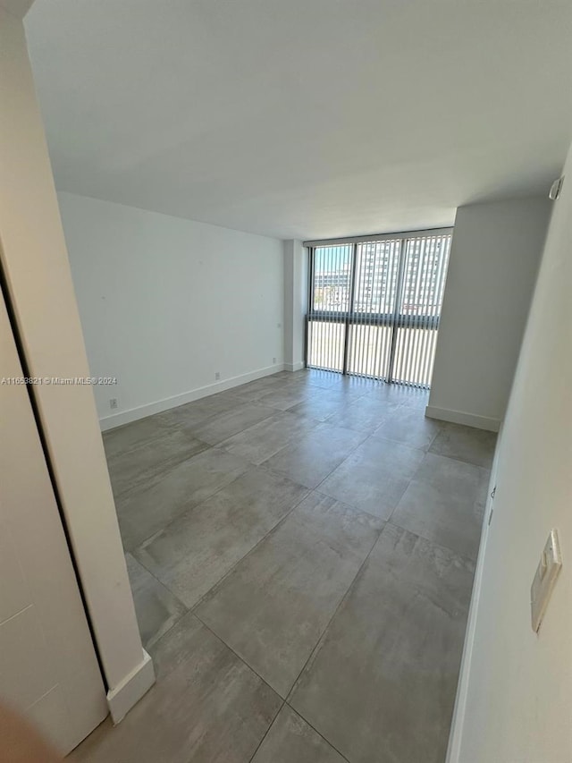 empty room with floor to ceiling windows