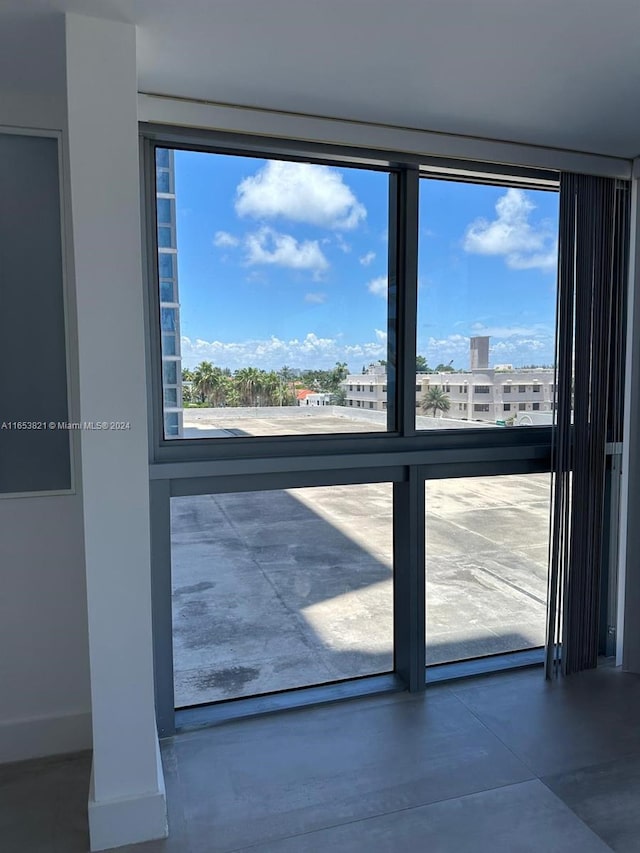 doorway featuring concrete floors