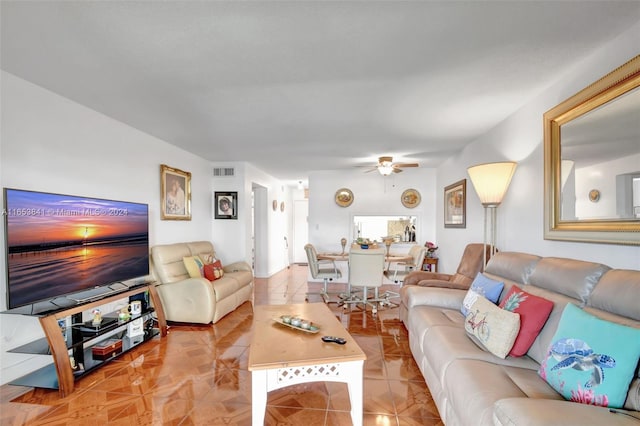 living room with light tile patterned floors and ceiling fan