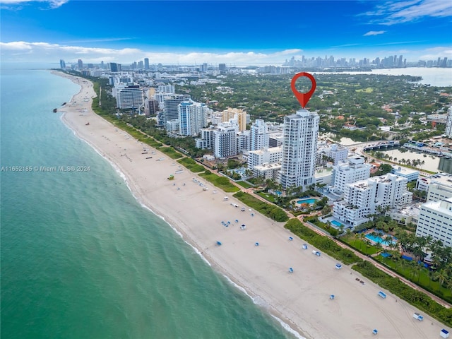 drone / aerial view with a view of the beach and a water view