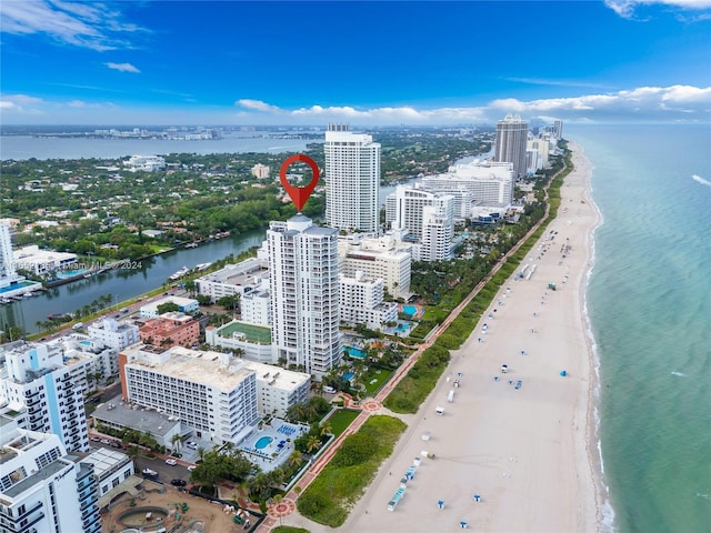 bird's eye view with a beach view and a water view