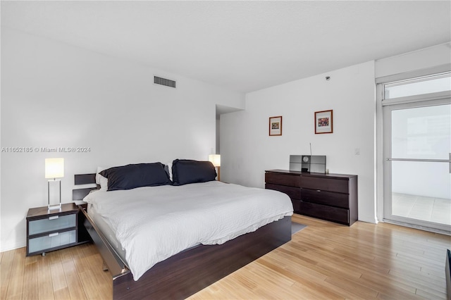 bedroom with light wood-type flooring