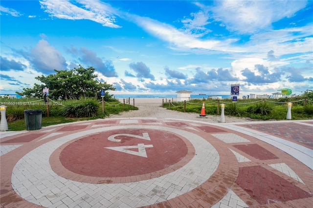 surrounding community featuring a water view