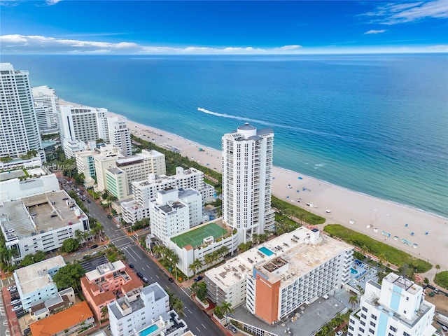 bird's eye view with a view of the beach and a water view