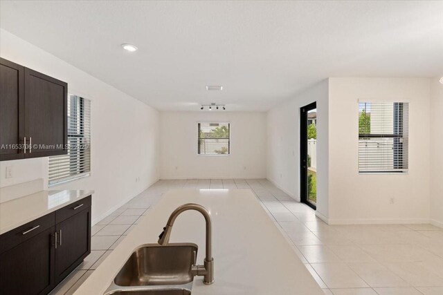 interior space featuring sink and light tile patterned floors