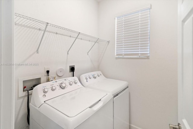 laundry room with washer and dryer