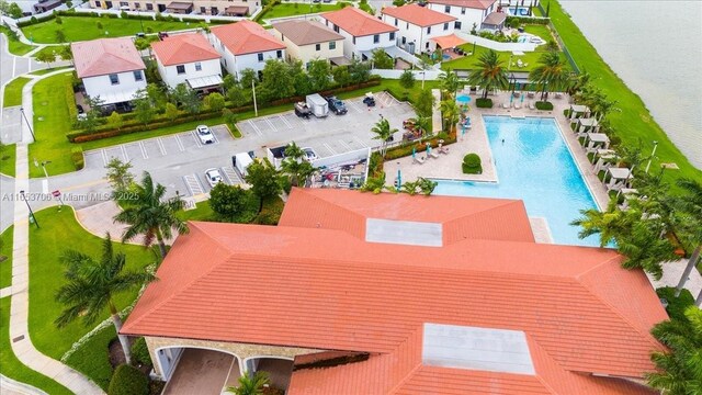 birds eye view of property with a water view