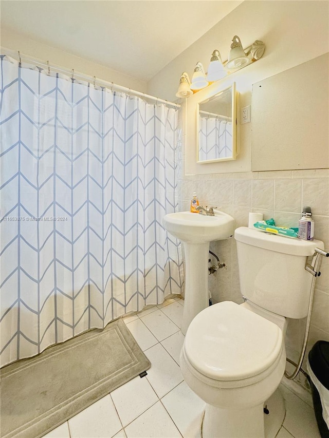 bathroom with tile walls, walk in shower, toilet, and tile patterned floors