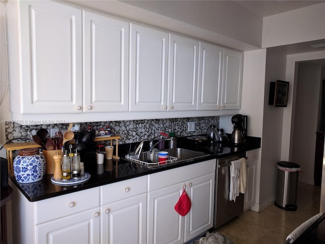 kitchen featuring dishwasher, sink, and white cabinets