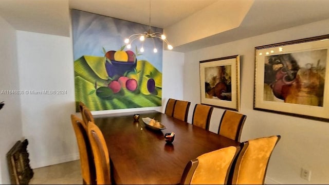 dining space with an inviting chandelier