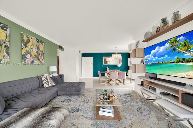 living room with ornamental molding and a notable chandelier