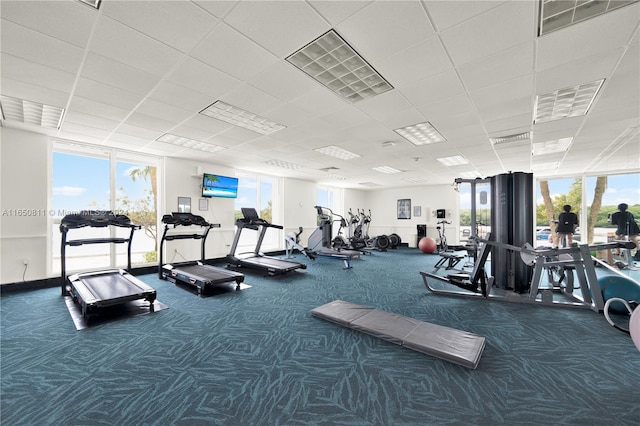 gym featuring dark colored carpet