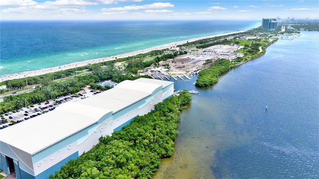 aerial view featuring a water view and a beach view