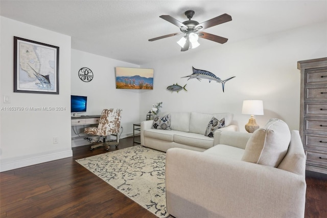 living room featuring ceiling fan and dark hardwood / wood-style flooring