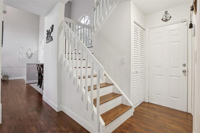 stairway with hardwood / wood-style flooring