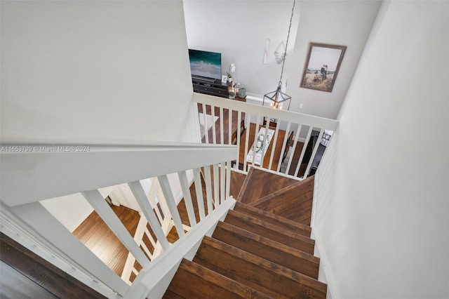 stairway with hardwood / wood-style flooring