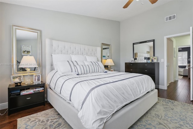 bedroom featuring dark hardwood / wood-style flooring and ceiling fan