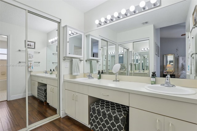 bathroom with vanity and hardwood / wood-style flooring