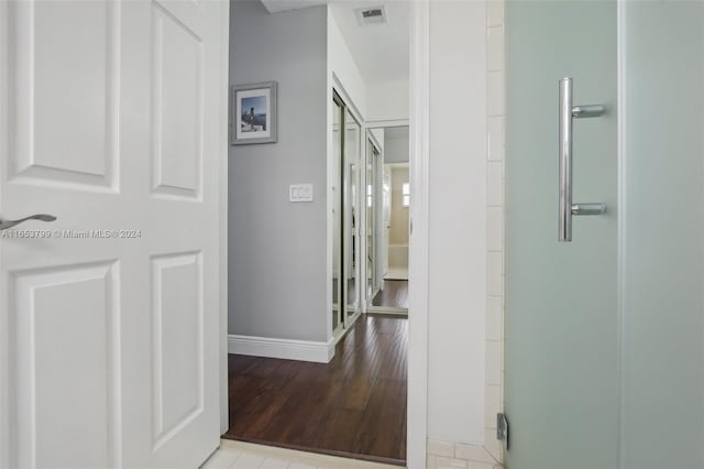 hall with light hardwood / wood-style flooring